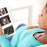 pregnant woman reviewing ultrasound scans