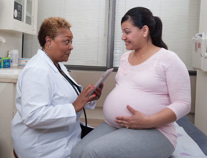 A pregnant woman with a doctor