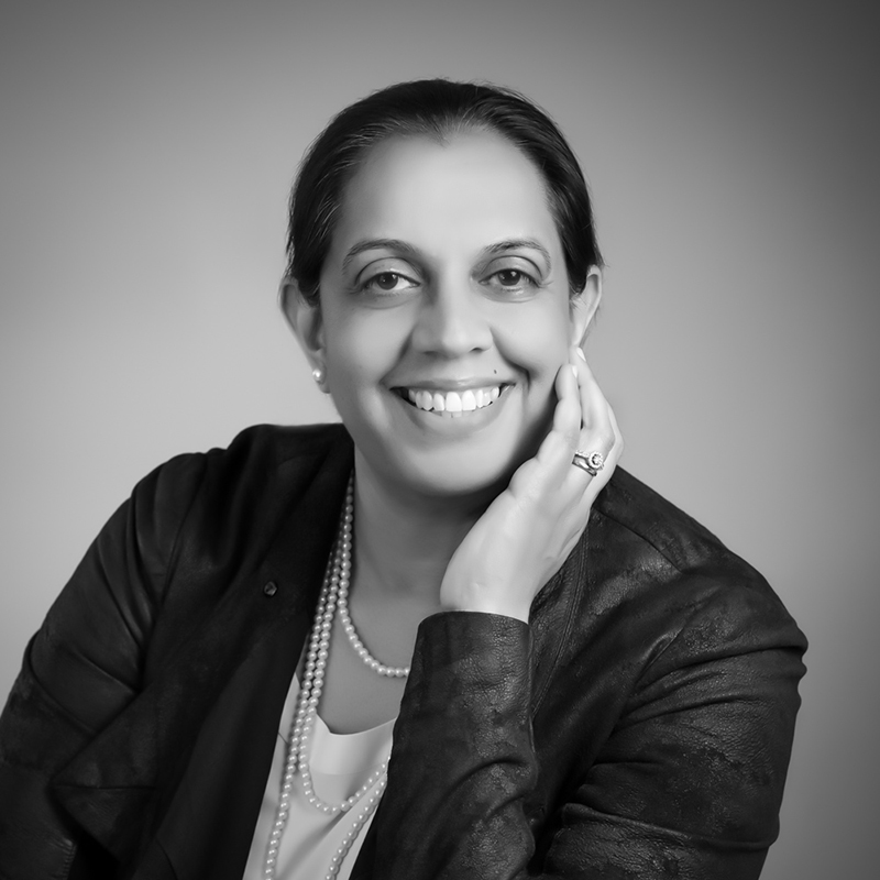 Black-and-white headshot of Dr. Una Grewal.