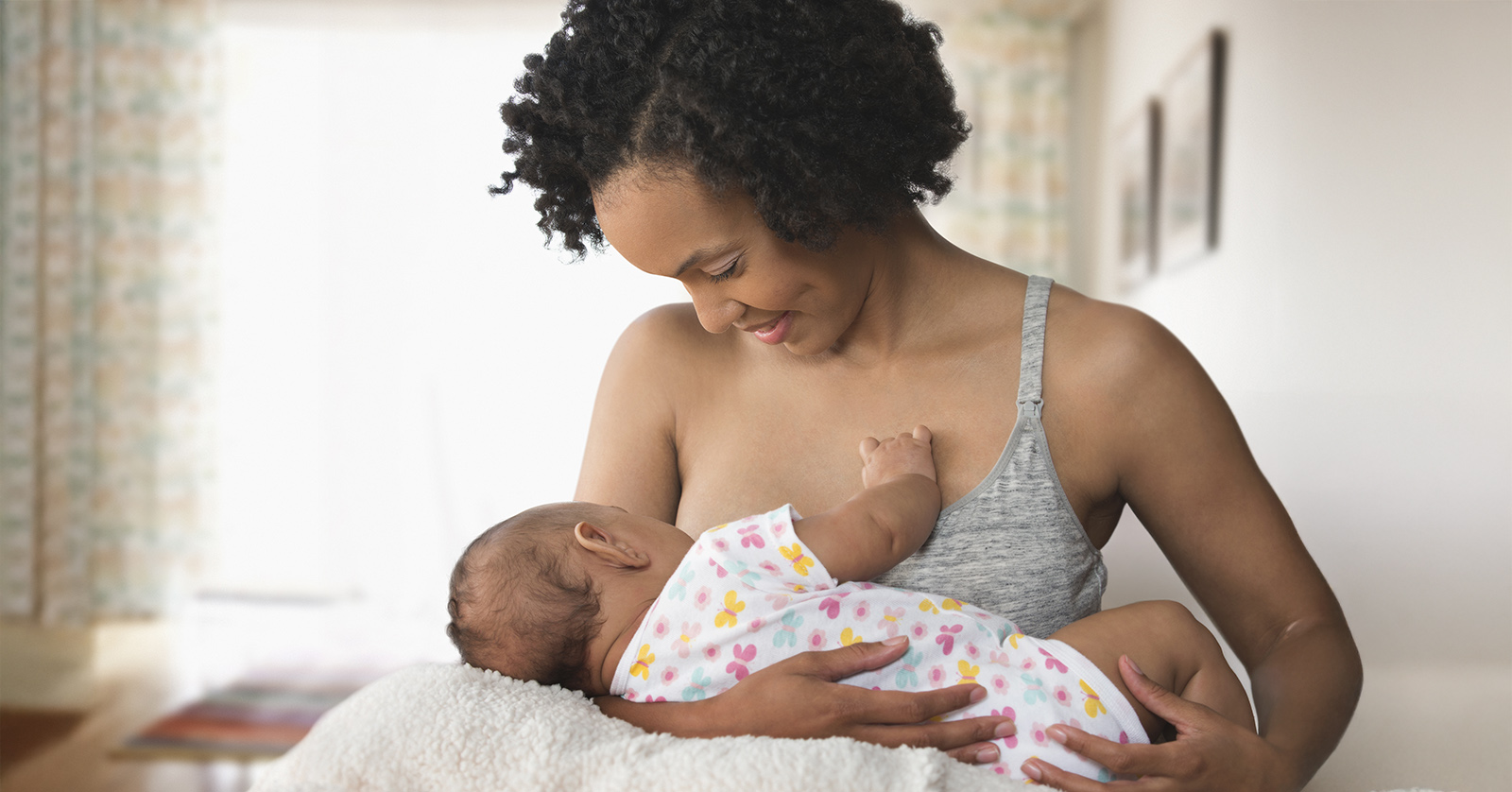 Woman breastfeeding infant.