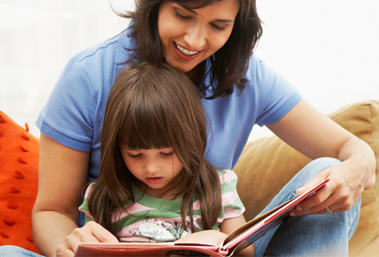 Stock image of parent and child  reading.